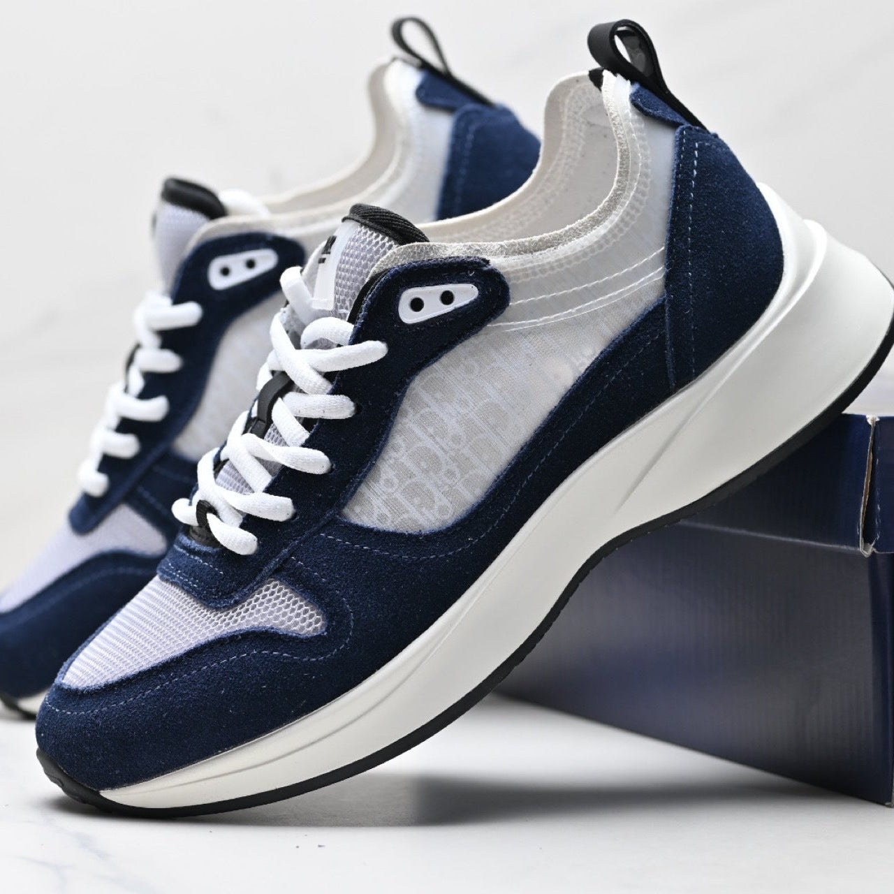 Navy and white sneakers with a white background
